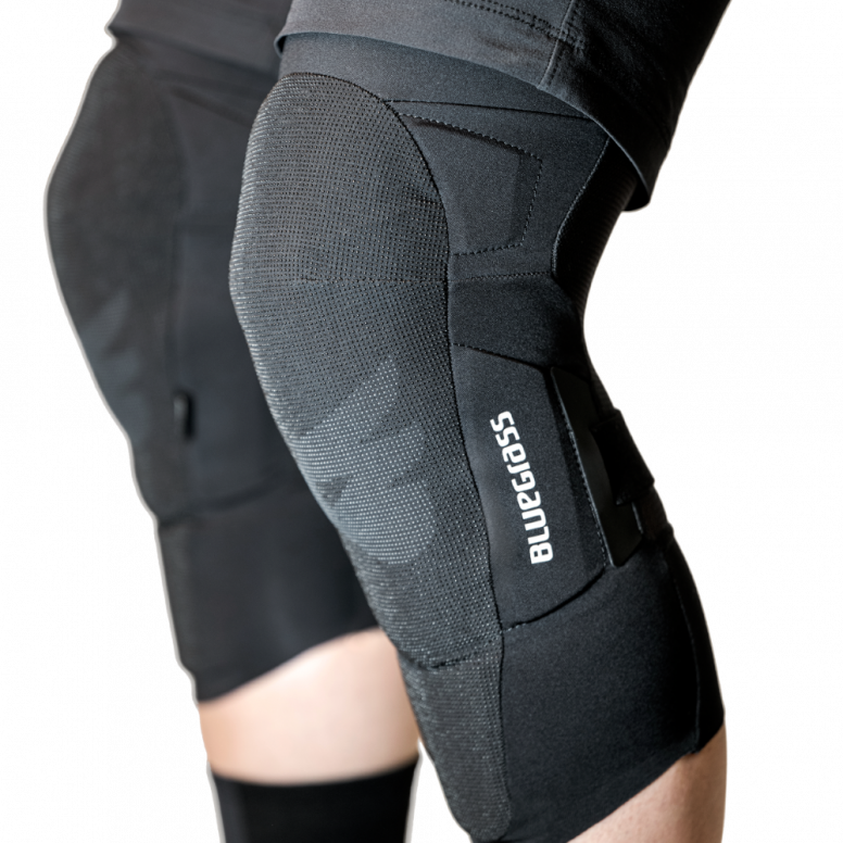 Rider wearing Bluegrass Aura Core knee pads on eMTB trail in Essex
