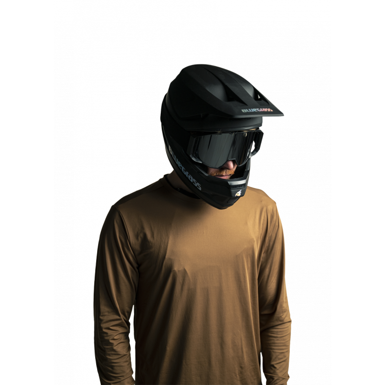 Rider wearing Bluegrass Arto armour on downhill MTB trail showing fit and coverage